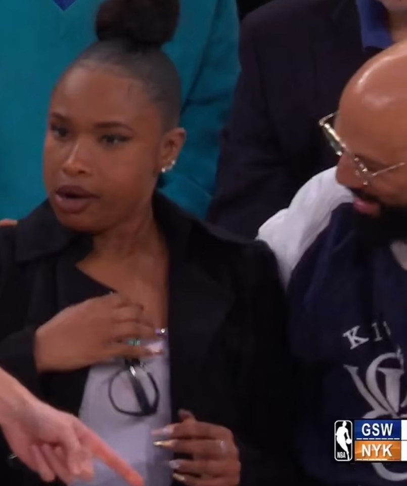 Jennifer Hudson reacts after being hit by a basketball at a Knicks game.