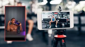 man working out at the gym and filming it for social media content