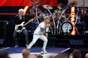 Arnel Pineda, Journey's lead singer, performing on stage.