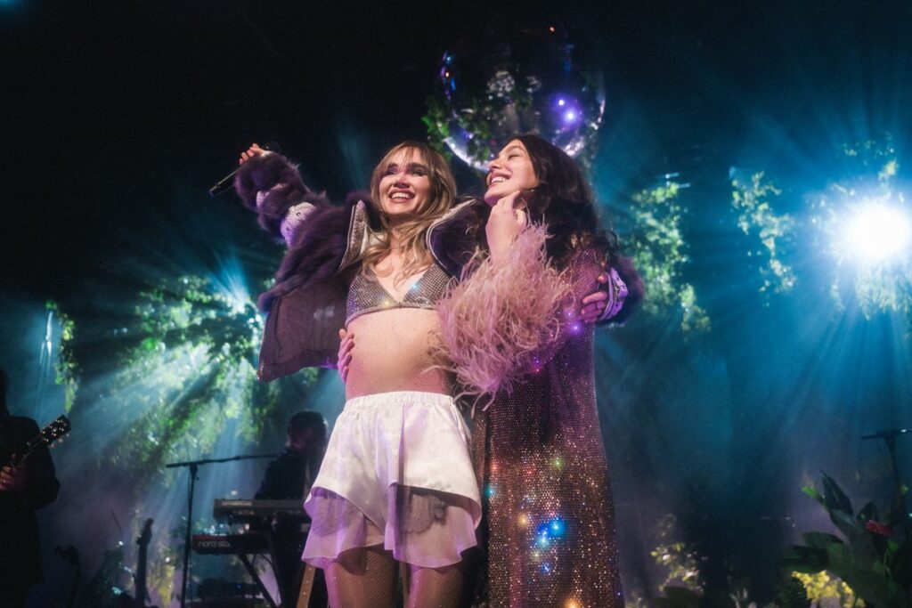 Suki Waterhouse and Camila Morrone appear on stage during The Sparklemuffin Tour