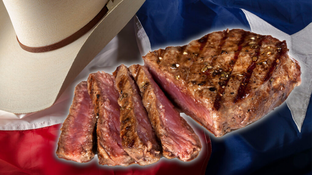 NY strip steak shown over Texas flag