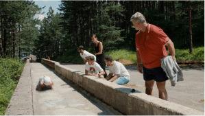 'The Track.' Coach Senad Omanović is at right, in red polo shirt.