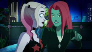 Harley and Ivy sitting together on a couch in the finale episode of Harley Quinn season 5.