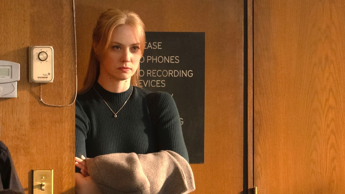 Karen page hols her jacket at the back of a courtroom on Daredevil: Born Again