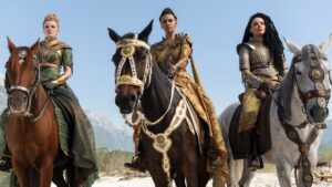 Elayne, Aviendha, and Egwene on horseback in a still from Wheel of Time season 3