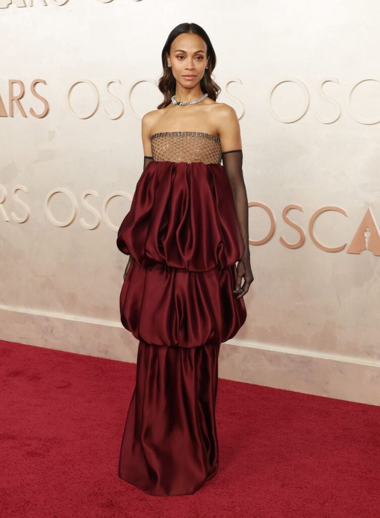 Emilia Perez actress Zoe Saldaña’s burgundy Saint Laurent look at the 2025 Oscars is pure elegance.