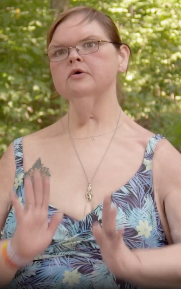 Tammy Slaton in a blue swimsuit, gesturing with her hands.