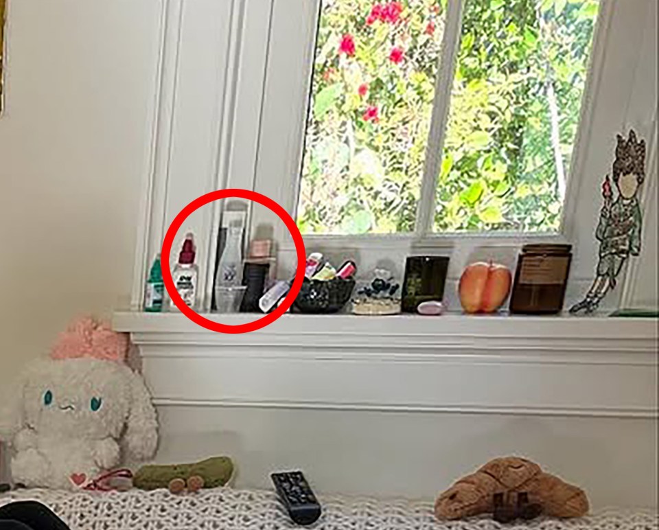 Toiletries and other items on a windowsill.
