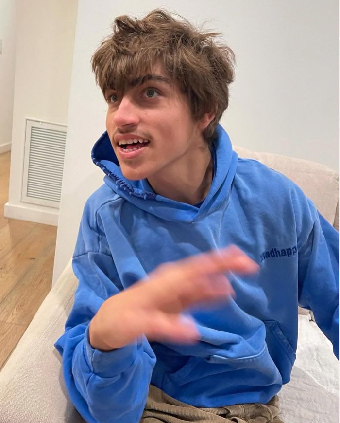 Colin Farrell's son, James, in a blue hoodie.