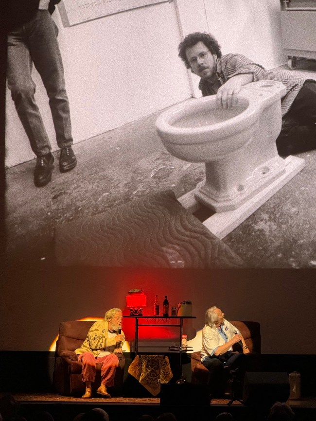 Jeff Bridges looking at his photos from the filming of The Big Lebowski with Ethan Cohen