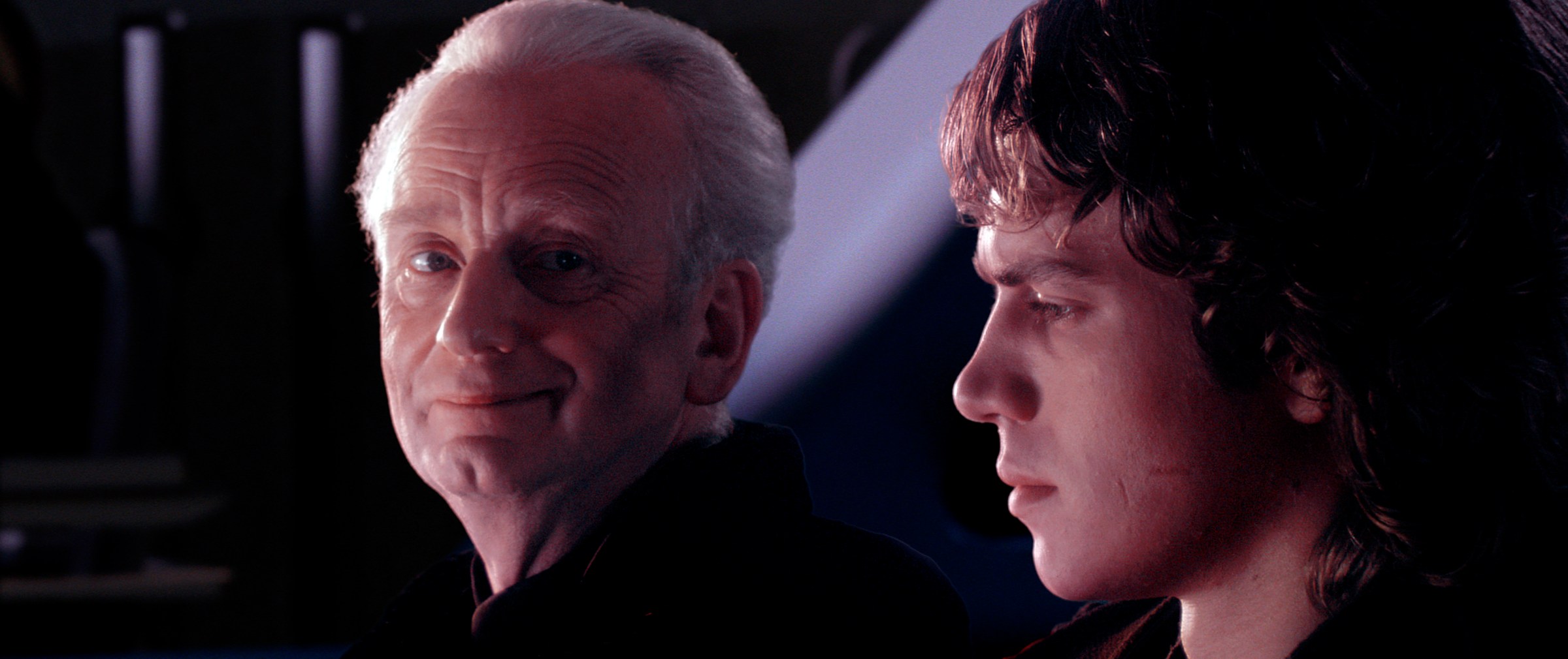 A slightly smirking Palpatine (Ian McDiarmid) gets ready to drop some Darth Plagueis knowledge on Anakin (Hayden Christensen) in Star Wars: Episode III — Revenge of the Sith