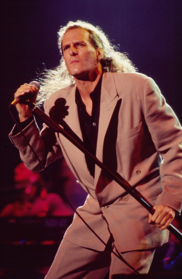 Michael Bolton performing onstage.