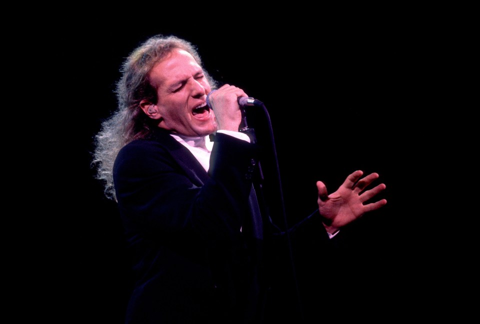 Michael Bolton performing on stage.