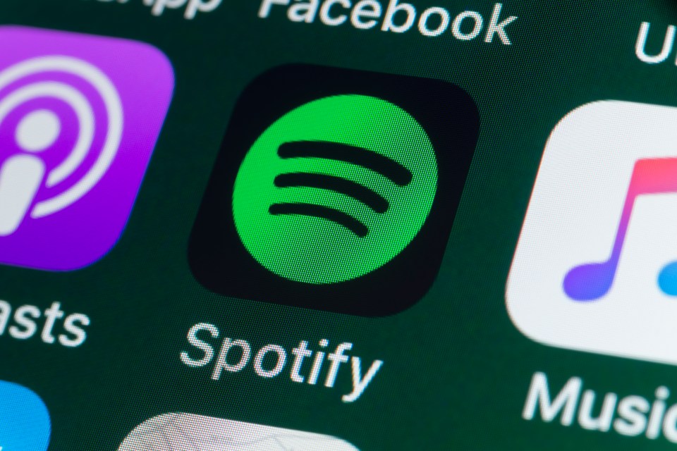 Close-up of the Spotify app icon on an iPhone screen.