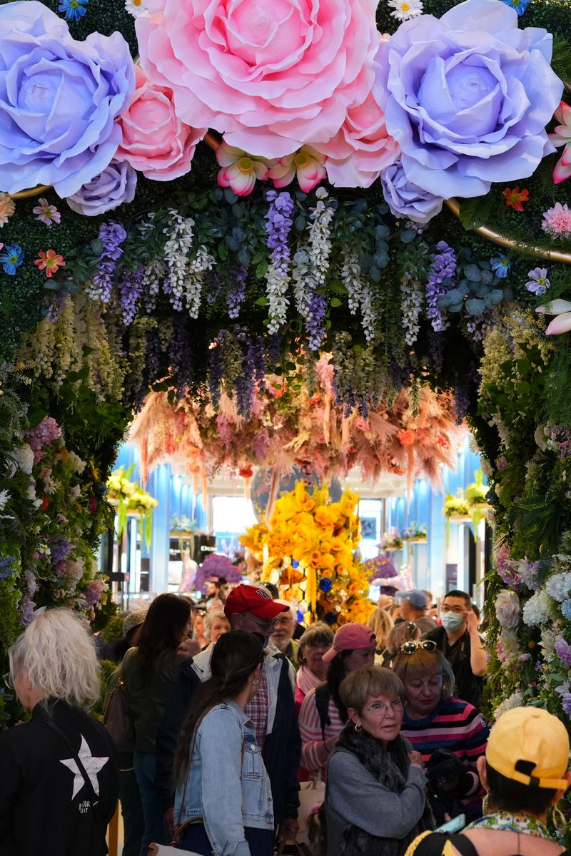 People view floral installations at Macy's store on April 28, 2025 in New York City. The Macy's Flower Show is back for its 50th anniversary this time with the theme "Surrealist Garden". (Photo by Liao Pan/China News Service/VCG via Getty Images)
