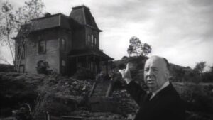 Alfred Hitchcock tours the sets of Psycho in 1960.