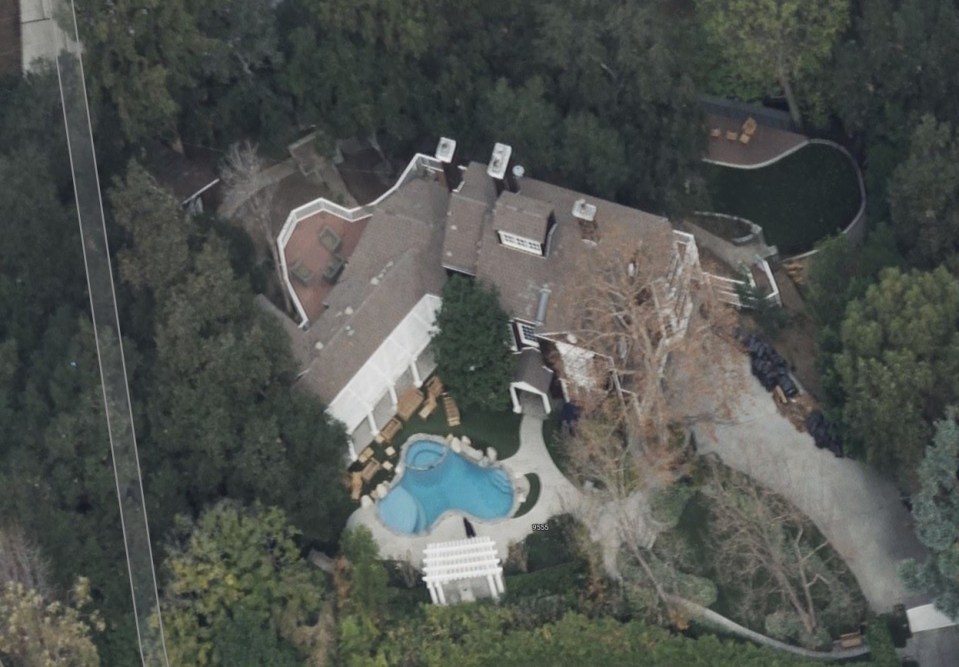 Aerial view of a Beverly Hills mansion with a pool.