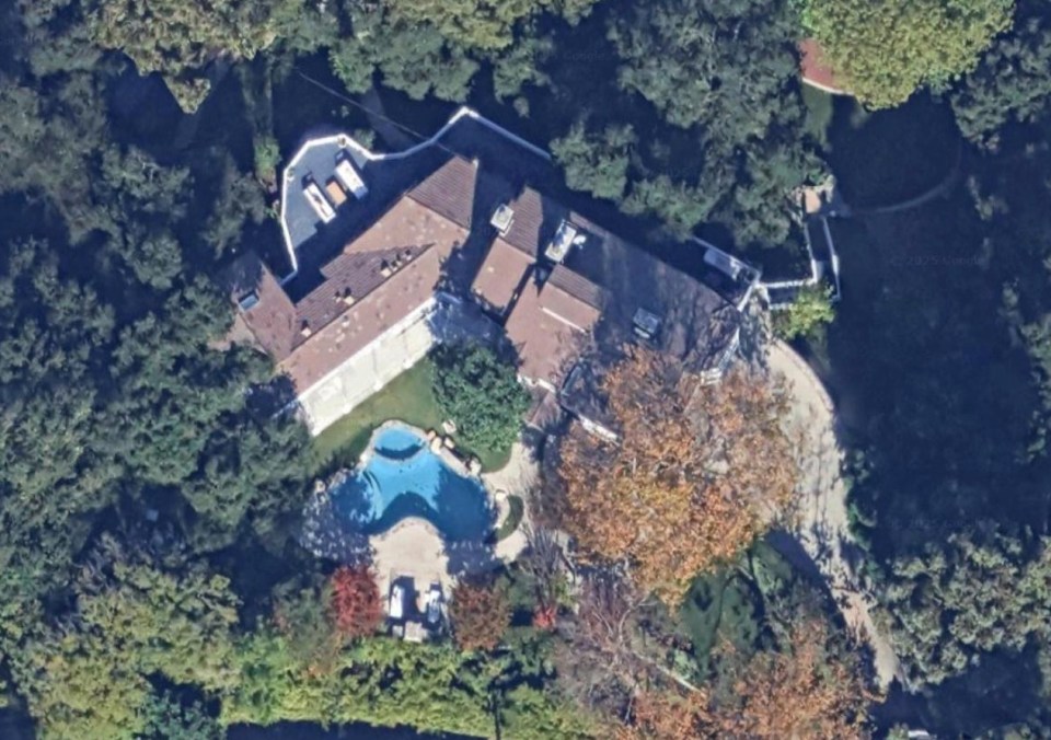 Aerial view of a Beverly Hills mansion with a pool.