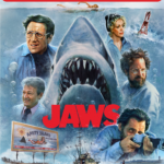 The box art for Jaws 4K Steelbook 50th anniversary release depicts the iconic shark image surrounded by Brody, Ellen, Hooper, Quint, and Mayor Vaughn.