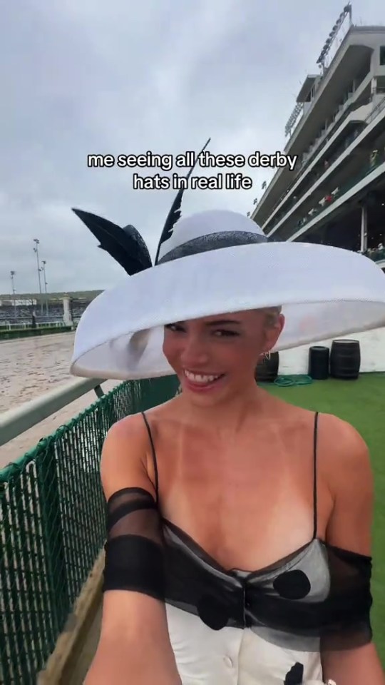 Woman in large white hat at the Kentucky Derby.