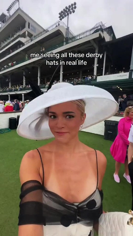 Woman in large white hat at the Kentucky Derby.