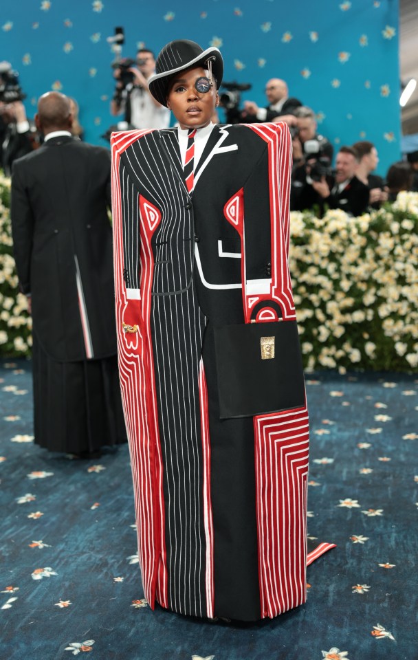 Janelle Monáe at the Met Gala in a black and red striped suit.