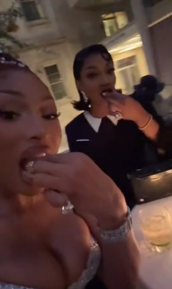 Megan Thee Stallion and another woman eating caviar at the Met Gala.