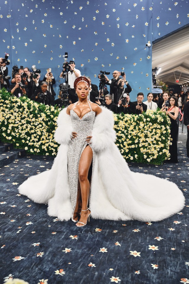 Megan Thee Stallion at the Met Gala in a silver sequined gown and white fur coat.