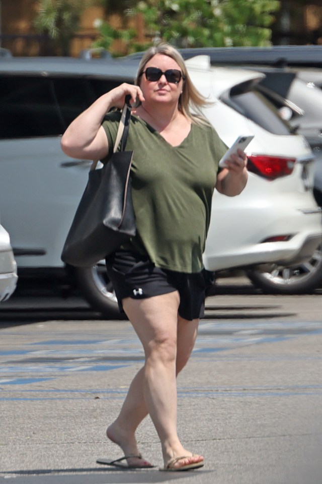 Brooke Thompson, aka "Pumpkin," walking in a parking lot.