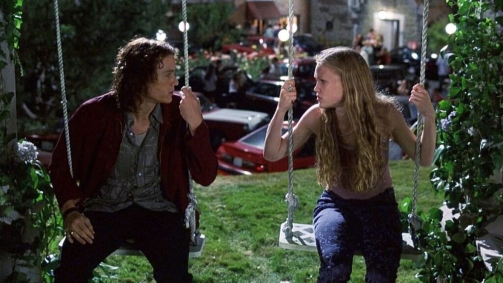 image of heath ledger and julia stiles in 10 things i hate about you movie facing each other on swings, film will get a sequel trilogy