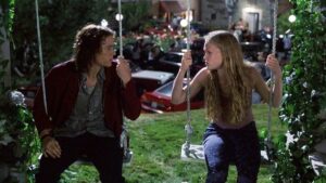 image of heath ledger and julia stiles in 10 things i hate about you movie facing each other on swings, film will get a sequel trilogy