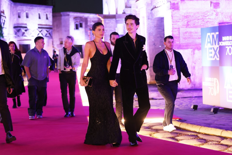 Kylie Jenner and Timothée Chalamet walking a red carpet.