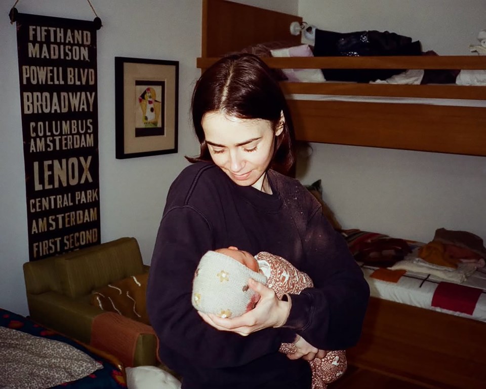 Lily Collins holding her baby girl, Tove.