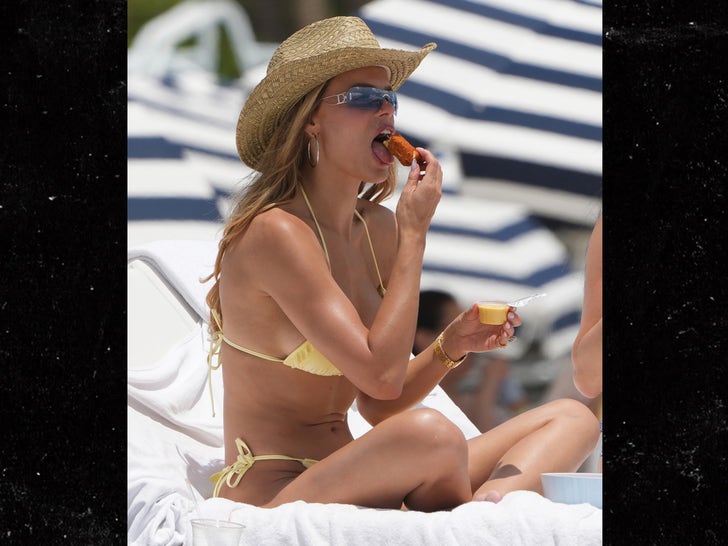 0507-Brooks-Nader--Wearing-A-Yellow-Bikini-On-The-Beach-In-Miami-primary-3