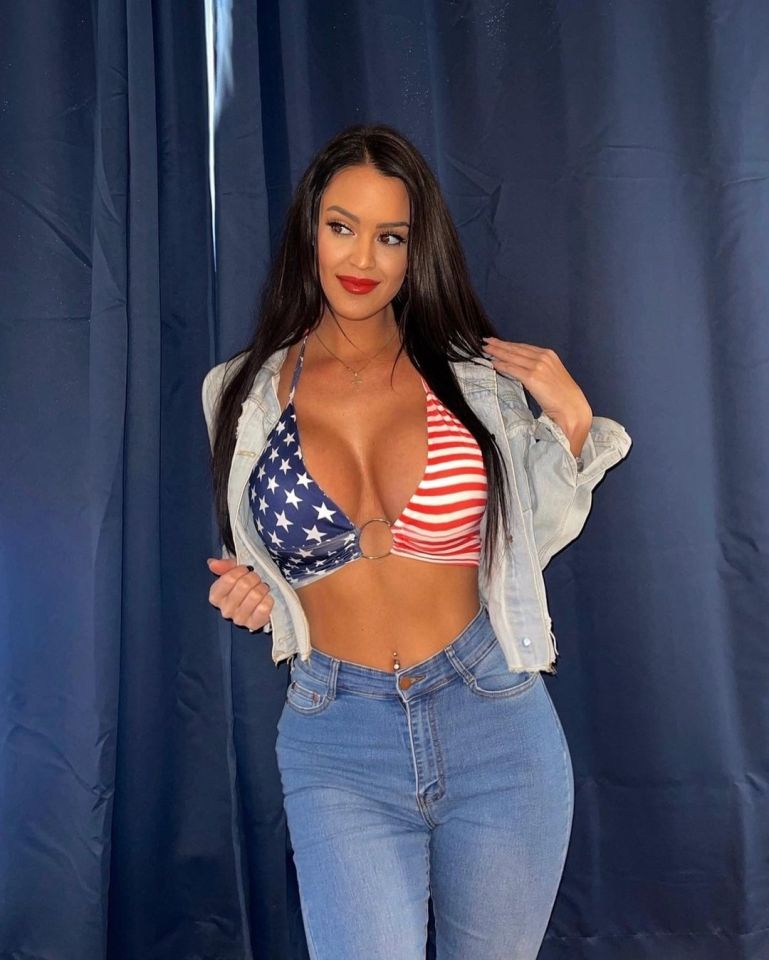 Woman in American flag-themed top and jeans.