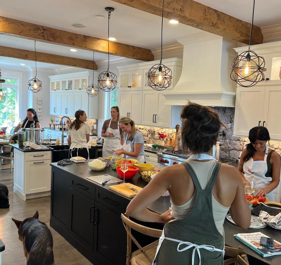 Carrie Underwood's kitchen with friends preparing a meal.
