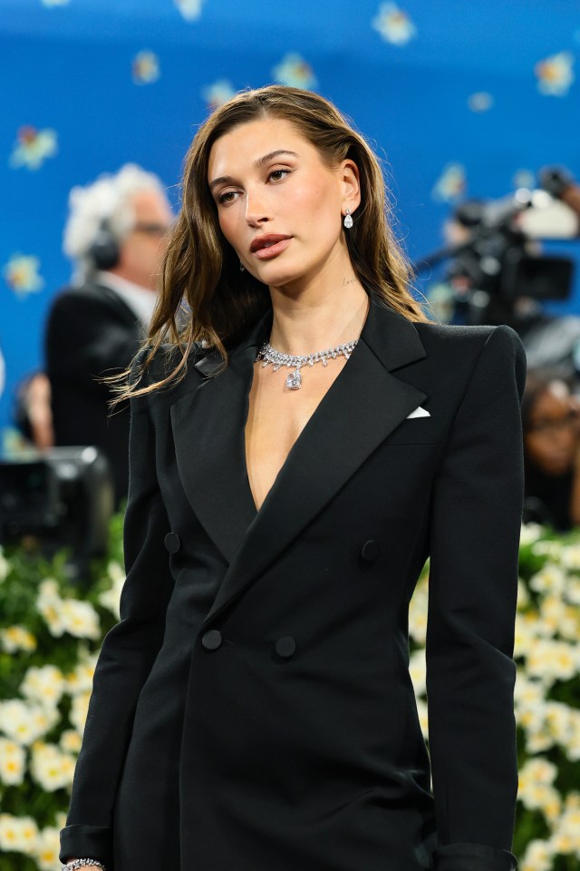 Hailey Bieber at the Met Gala in a black tuxedo.