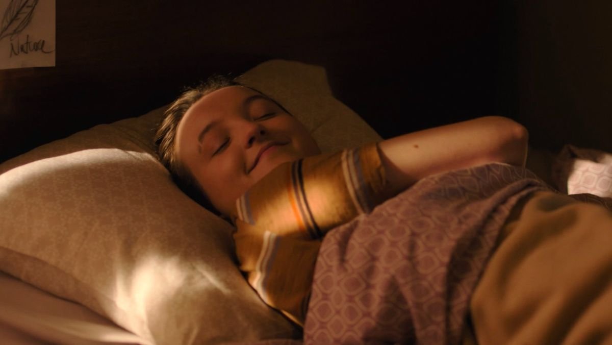 Ellie happy in bed in the last of us season two episode five