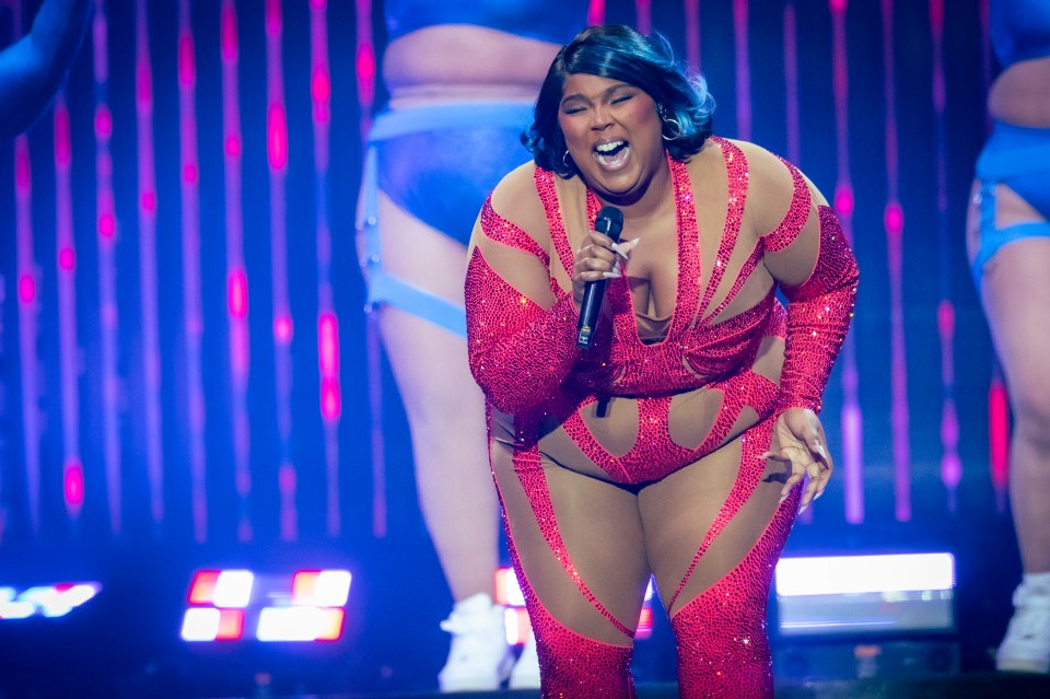 Lizzo performing on stage.