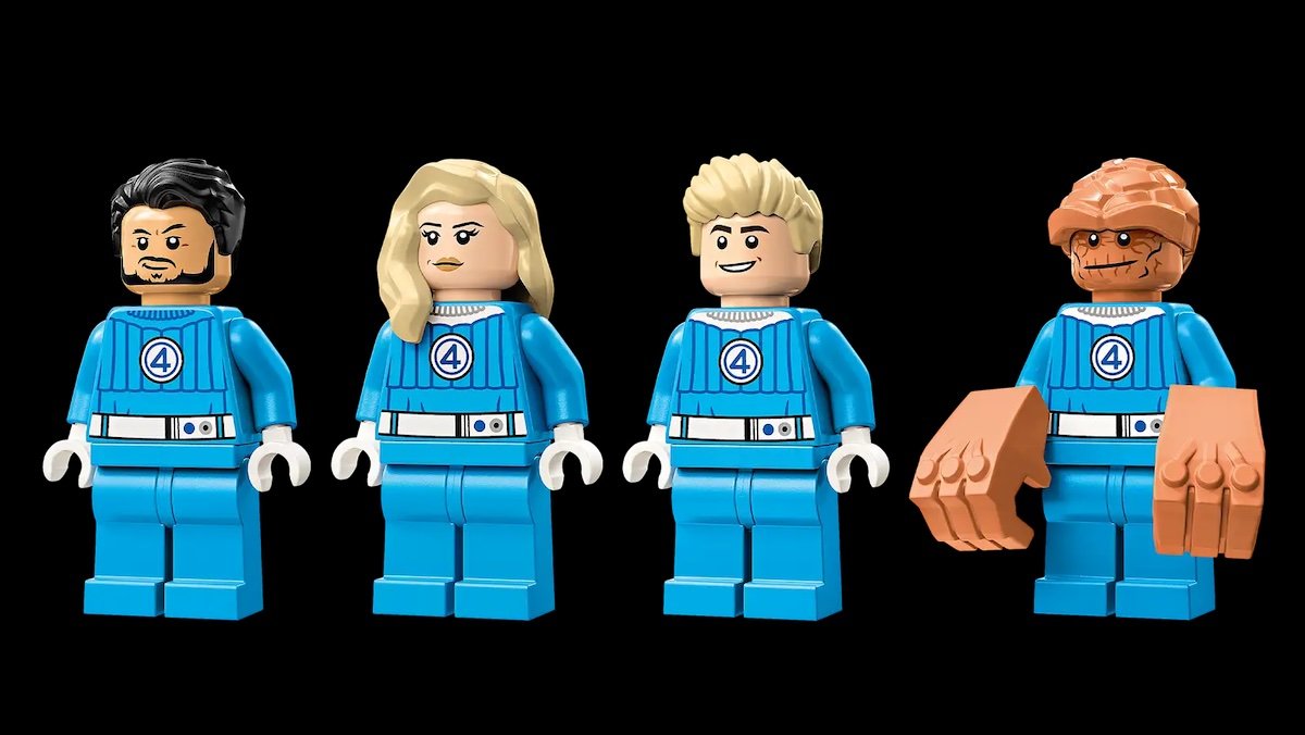 Four LEGO minifigs of the Fantastic Four in blue uniforms