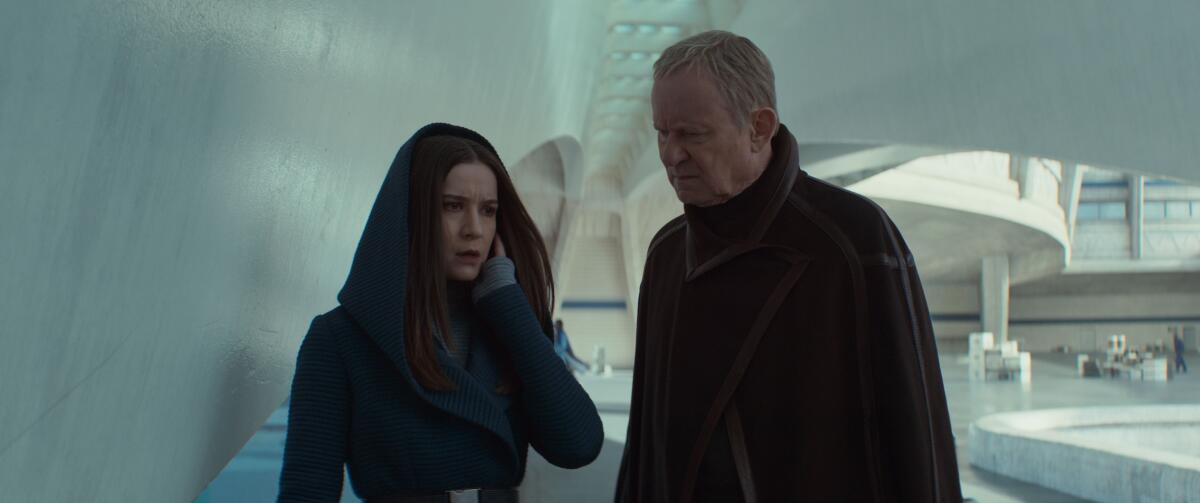 a woman and man looking concerned