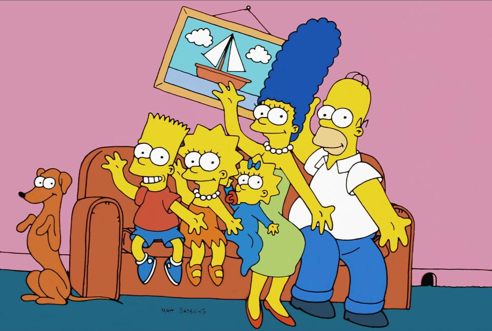 Illustration of the Simpsons family on a couch with their dog.