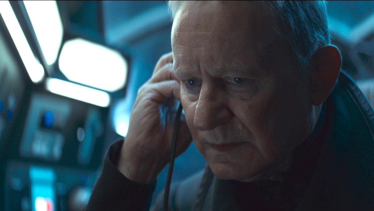 Stellan Skarsgård as Luthen listens to headphones on Andor