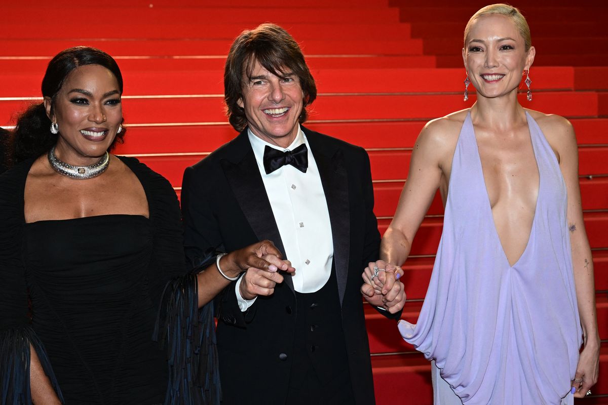 Angela Bassett, Tom Cruise and Pom Klementieff leave after the screening of the film "Mission: Impossible - The Final Reckoning" at the 78th edition of the Cannes Film Festival 