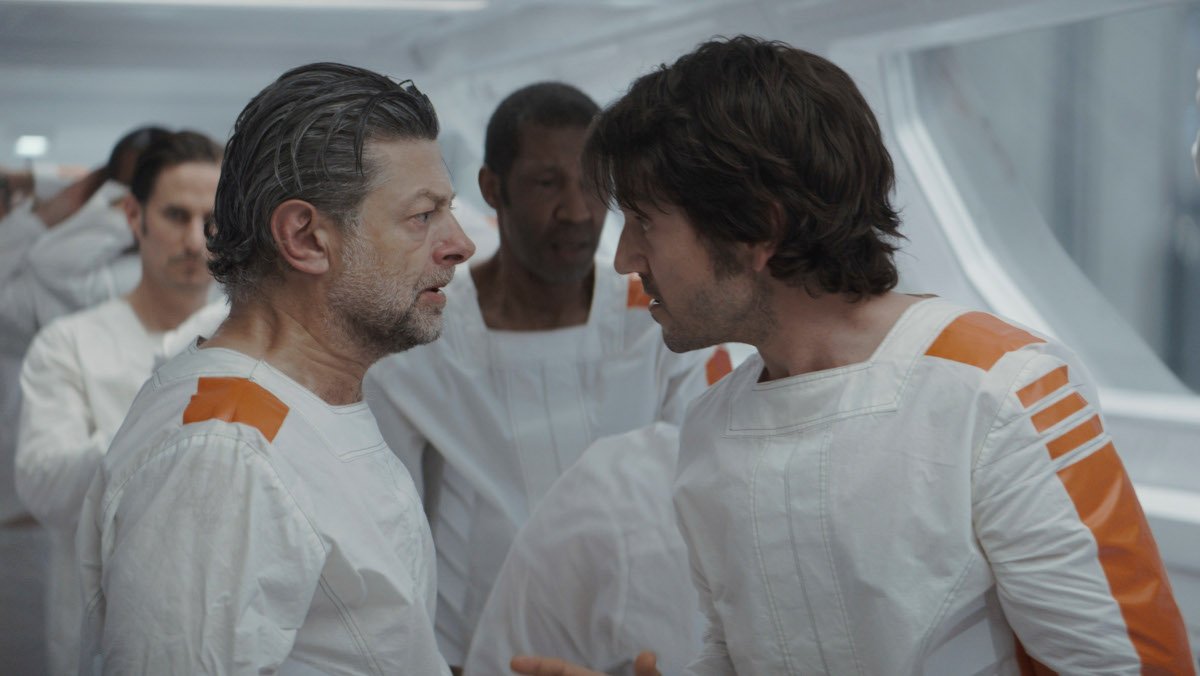 Cassian talks to Kino in the prisoner hallway