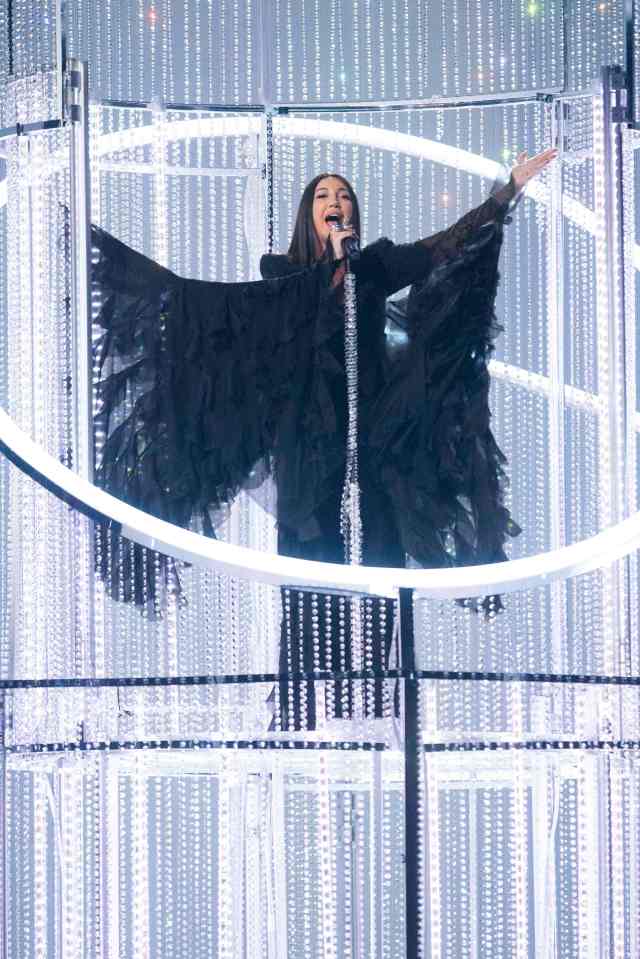 Singer performing on stage at the Eurovision Song Contest.