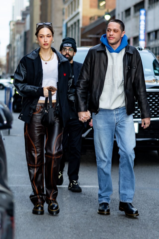 Elsie Hewitt and Pete Davidson holding hands.