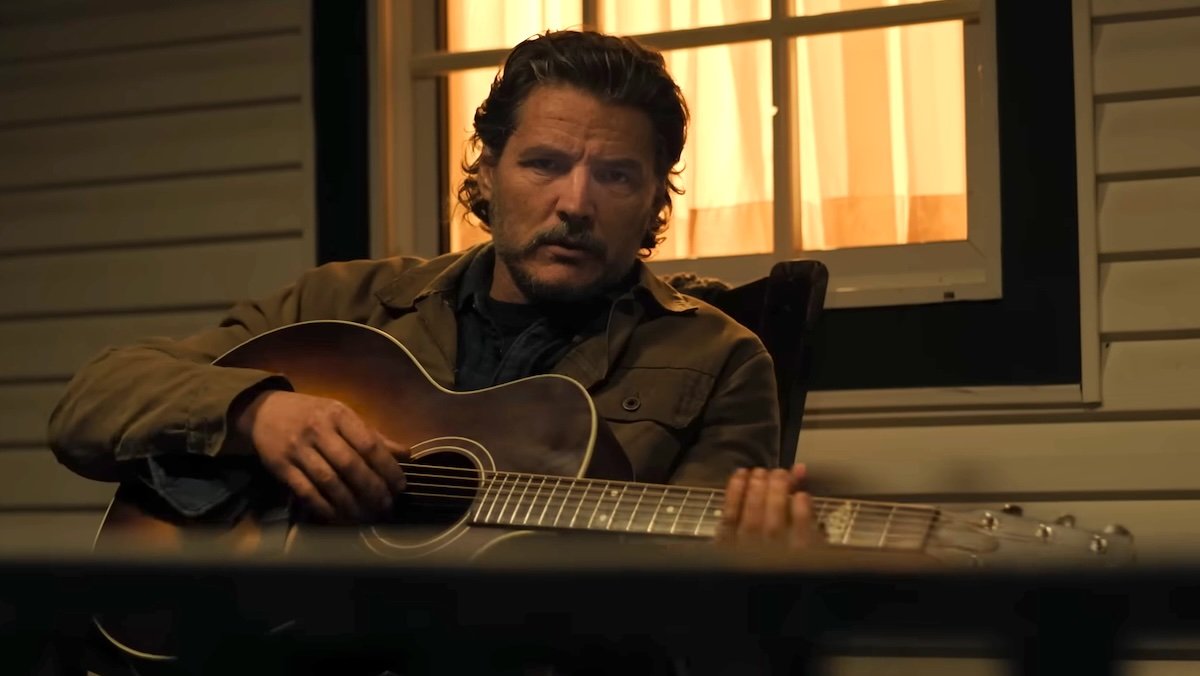 Joel sitting on his porch at night holding a guitar on The Last of Us, including Joel and Ellie goodbye scene from the video games feels like a mistake