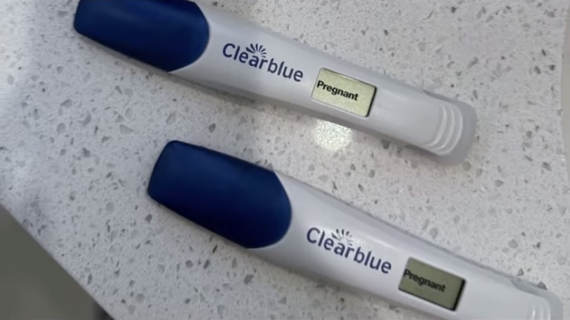 Two positive Clearblue pregnancy tests.