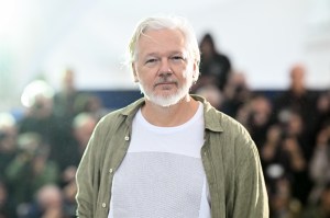Julian Assange poses during the "The Six Billion Dollar Man" photocall at the 78th annual Cannes Film Festival at Palais des Festivals on May 20, 2025 in Cannes, France.